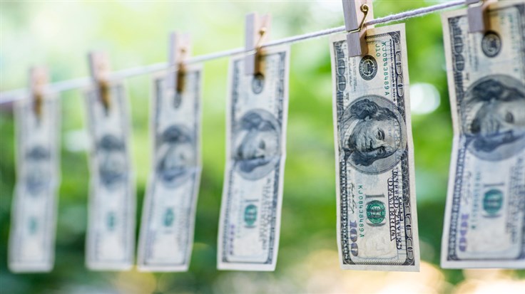 money hanging from a laundry line